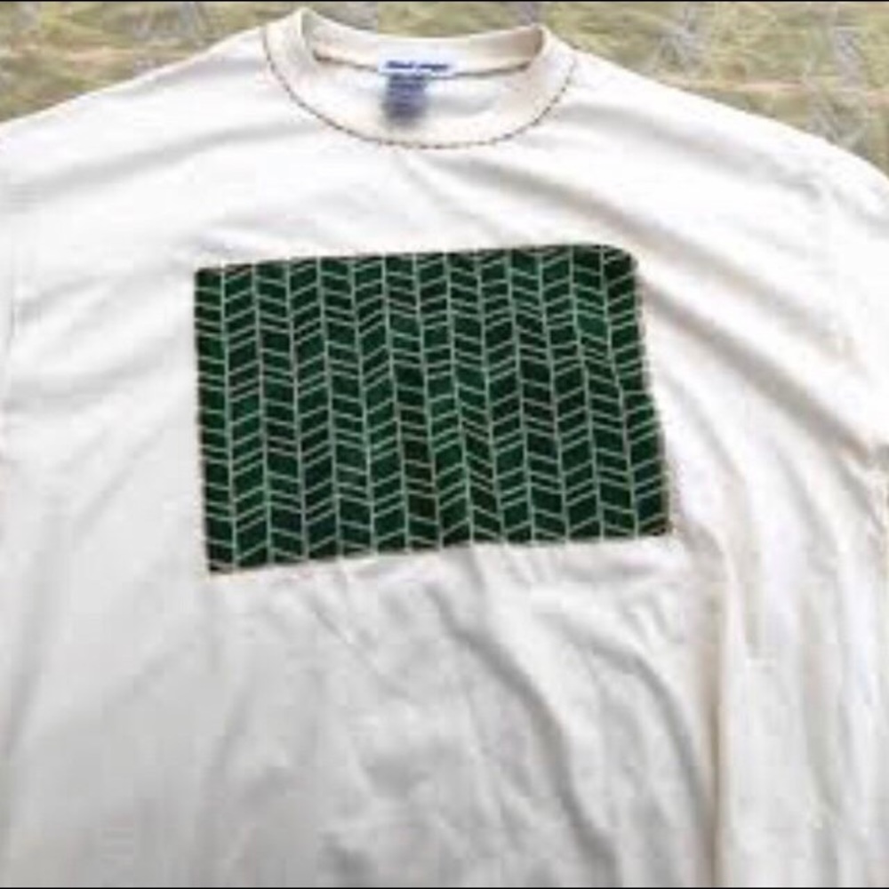 Unisex Shirt. We carry sizes Small - XL